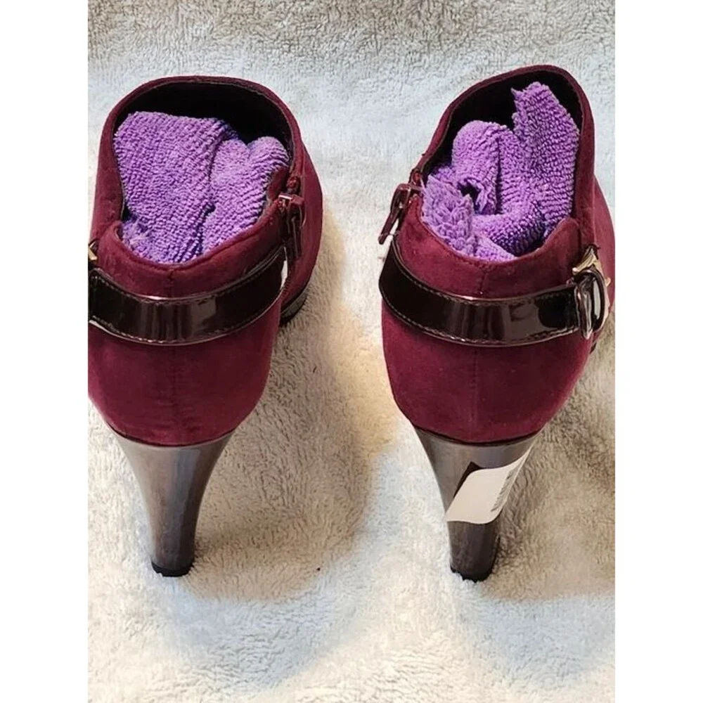 Women’s East 5th faux suede ankle booties in a rich maroon color with glossy pat